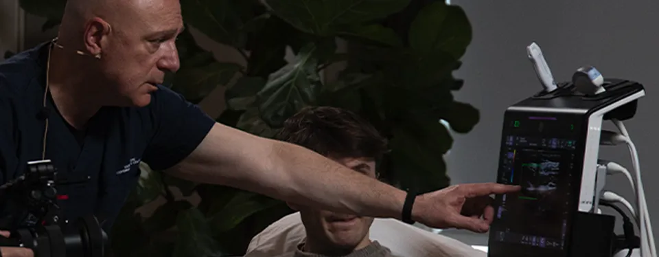 Dr. Filipovski demonstrating spasticity ultrasound technique